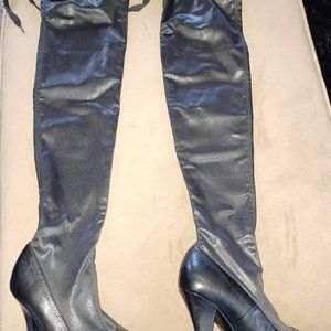 Black thigh-high boots, snakeskin fabric uppers; bonded leather lowers.